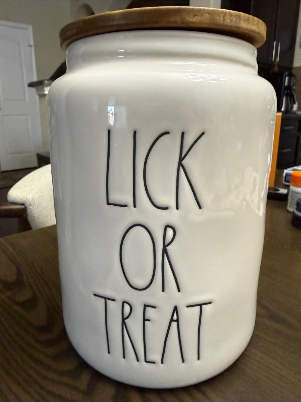 Rae Dunn White Ceramic Halloween Dog Treat Canister with Woodgrain Lid.
